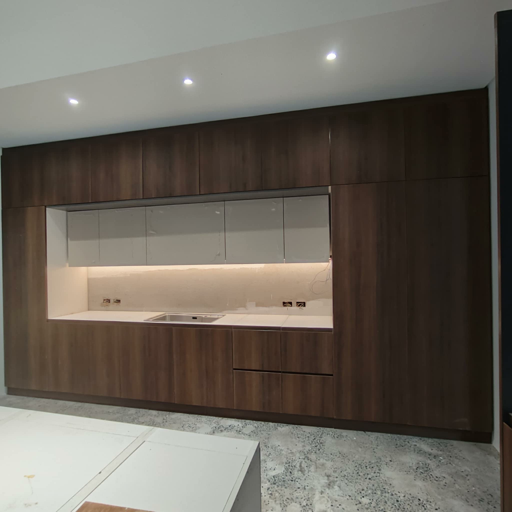 Blue kitchen with white backsplash